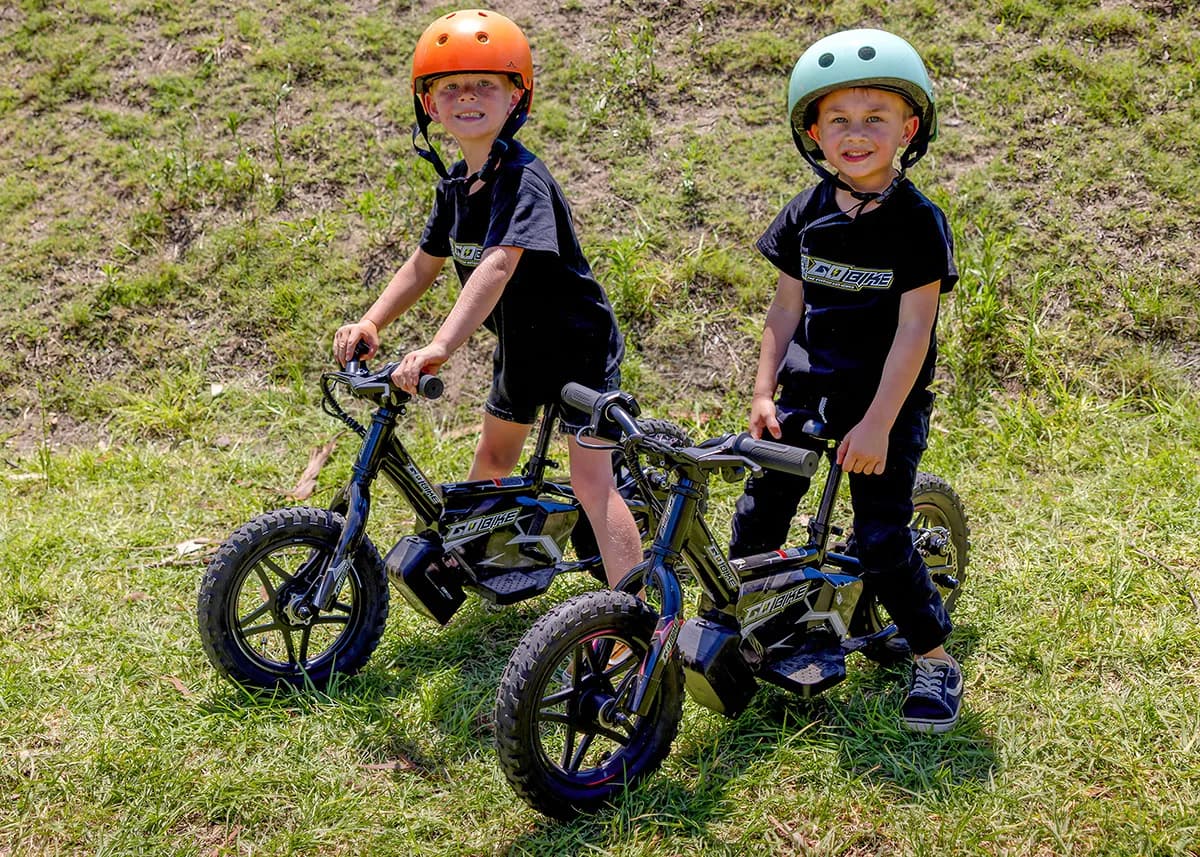 A happy kid with the GoBike 12 e-bike