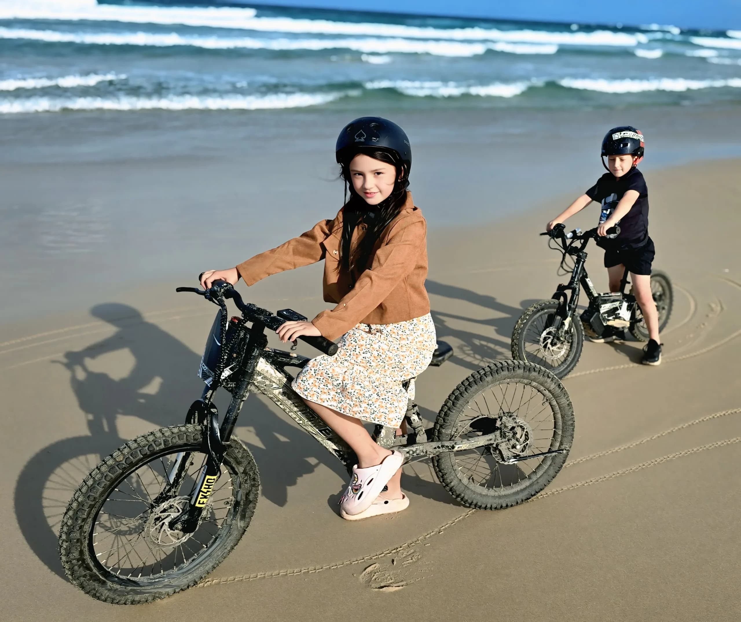 A child standing with a GoBike 14, representing the future of fun for kids electric balance bikes