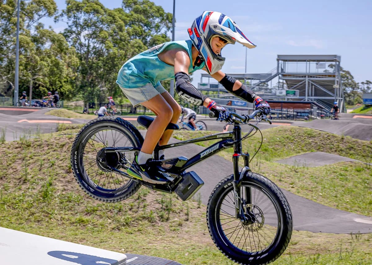 Action shot of a kid jumping the GoBike 20, showcasing its performance suspension.