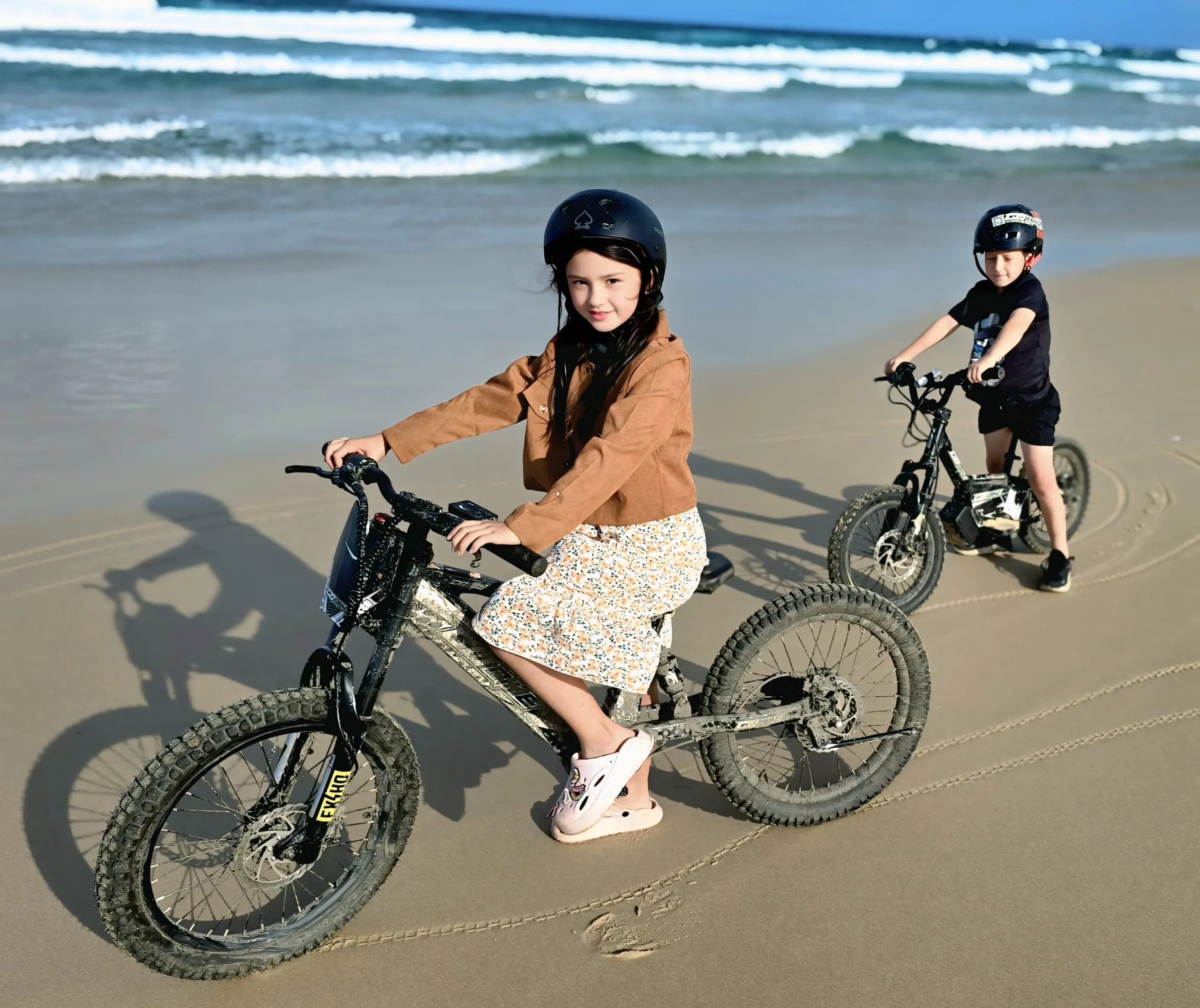 A child standing with a GoBike 14, representing the future of fun for kids electric balance bikes